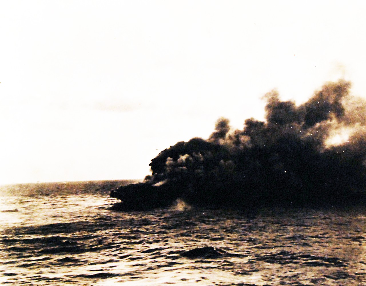 80-G-16642:   Battle of the Coral Sea, May 1942.    USS Lexington (CV 2) on fire following the Battle of the Coral Sea, 8 May 1942.   Ship is burning after explosion.  Survivors are picked up while Captain Sherman is still on board.  Official U.S. Navy Photograph, now in the collections of the National Archives.     (4/10/2014).