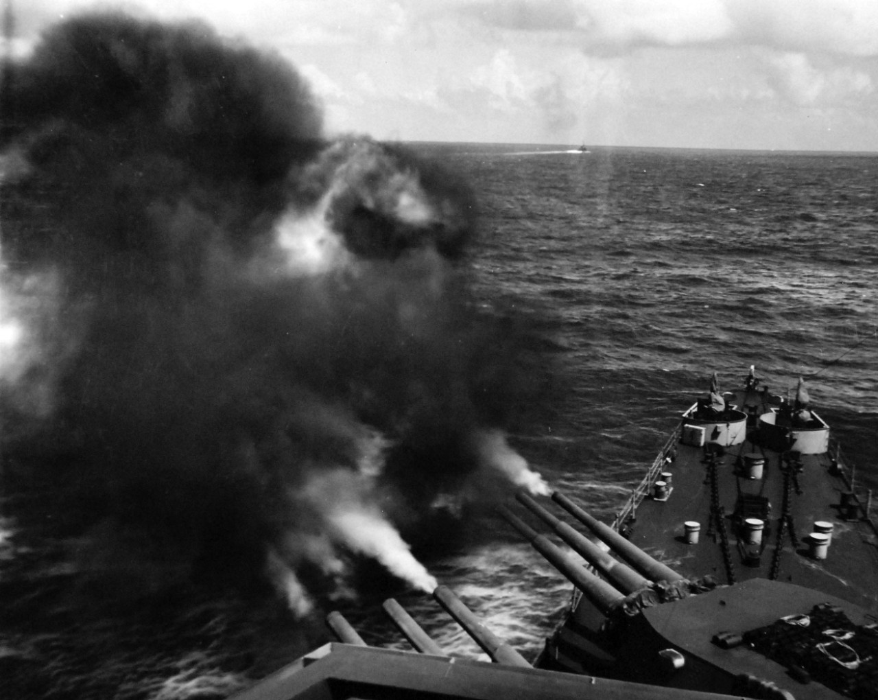 80-G-55232:  Wake Island Raid, October 5-6, 1943.   USS Minneapolis’ (CA 36) 5” main firing on Wake Island during the raid of October 5, 1943.  Photographed by CPU-7.   U.S. Navy photograph, now in the collections of the National Archives.  (2015/4/28).
