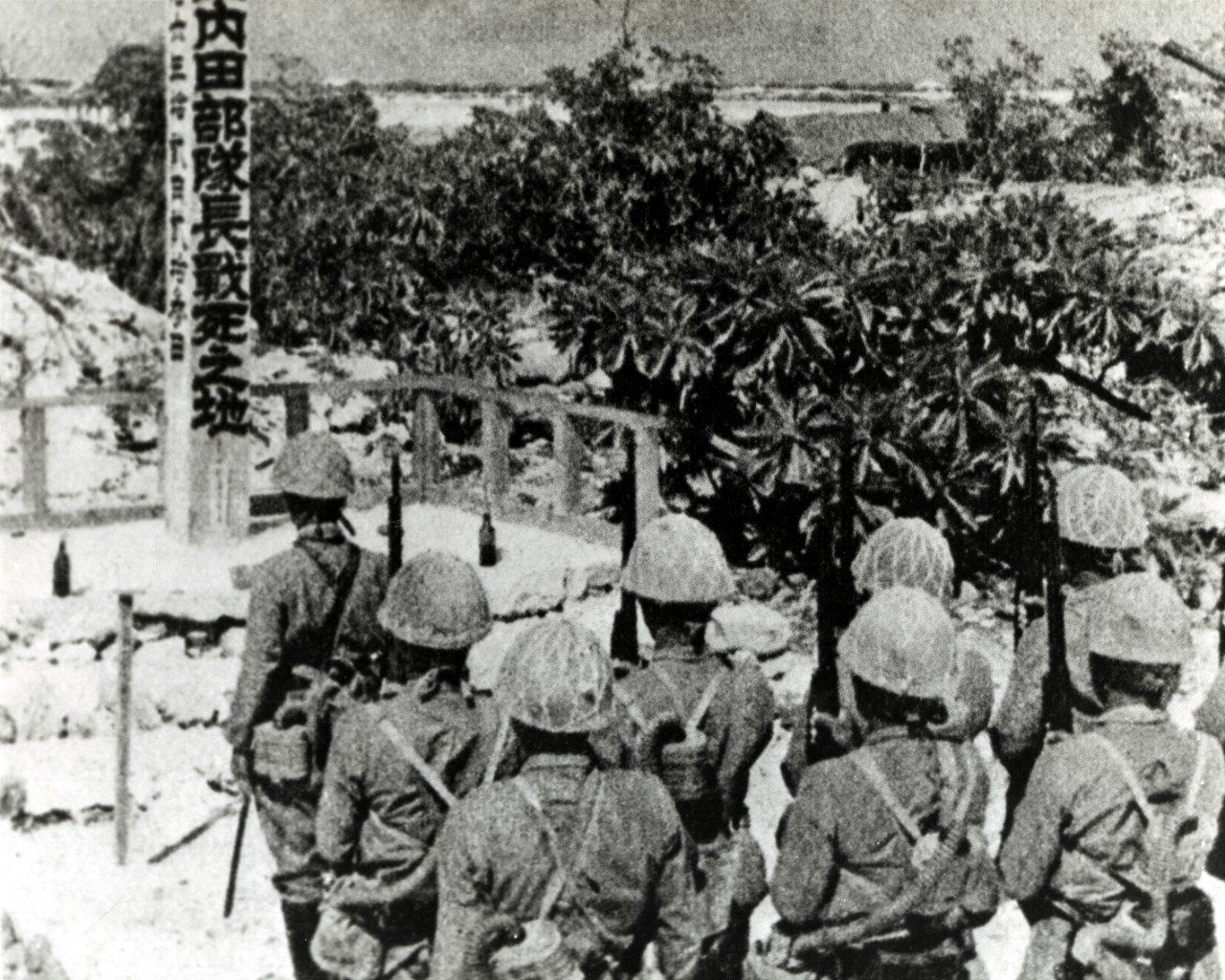 USMC 315175:  Wake Island, December 23, 1941.  Japanese troops pay homage to a memorial erected to unit commander Uchida, who was killed in the landing on Wake Island, 23 December 1941.  Copied from a Japanese picture book. U.S. Marine Corps photograph.