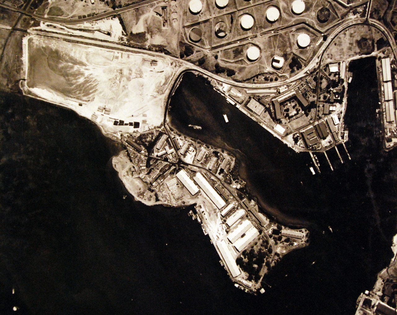 80-G-182875:   Aerial of U.S. Naval Air Station, Pearl Harbor, Supply Base, Magazine Island (lower enter), Navy Yard Submarine Base (right center).   Photograph received August 22, 1941.  U.S. Navy photograph, now in the collections of the National Archives (8/25/2015).