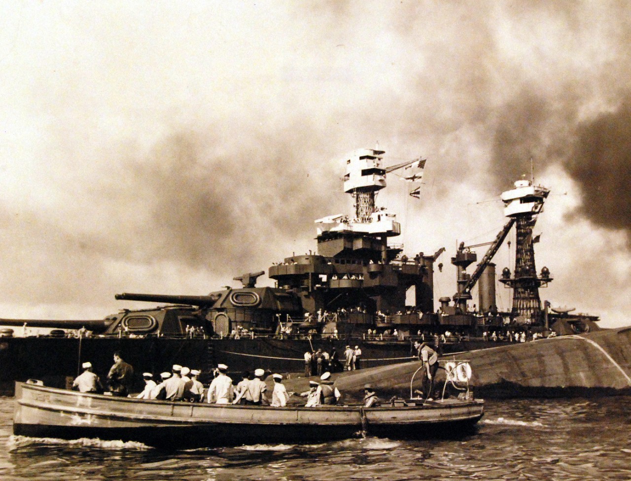 80-G-32488:  Japanese Attack on Pearl Harbor, December 7, 1941.  View of “Battleship Row” during or immediately after the Japanese raid.  The capsized USS Oklahoma (BB 37) is in the center, alongside USS Maryland (BB 46). Official U.S. Navy photograph, now in the collections of the National Archives.   (9/15/15).