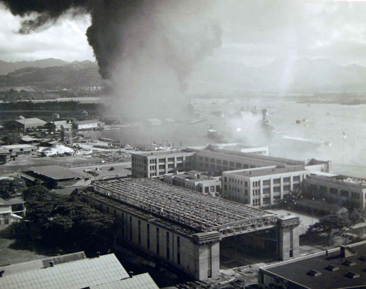 80-G-32588:  Japanese Attack on Pearl Harbor, December 7, 1941.   Burning and damaged ships in battleship row.   Official U.S. Navy photograph, now in the collections of the National Archives.     (7/2/2014).