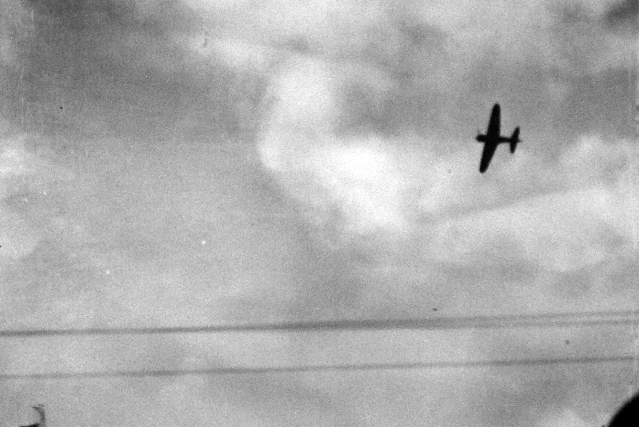 80-G-32631:  Japanese Attack on Pearl Harbor, December 7, 1941.     Japanese A6M2 “Zeke” aircraft during aerial attack on Pearl Harbor, Territory of Hawaii.  Official U.S. Navy photograph, now in the collections of the National Archives.        (7/2/2014).