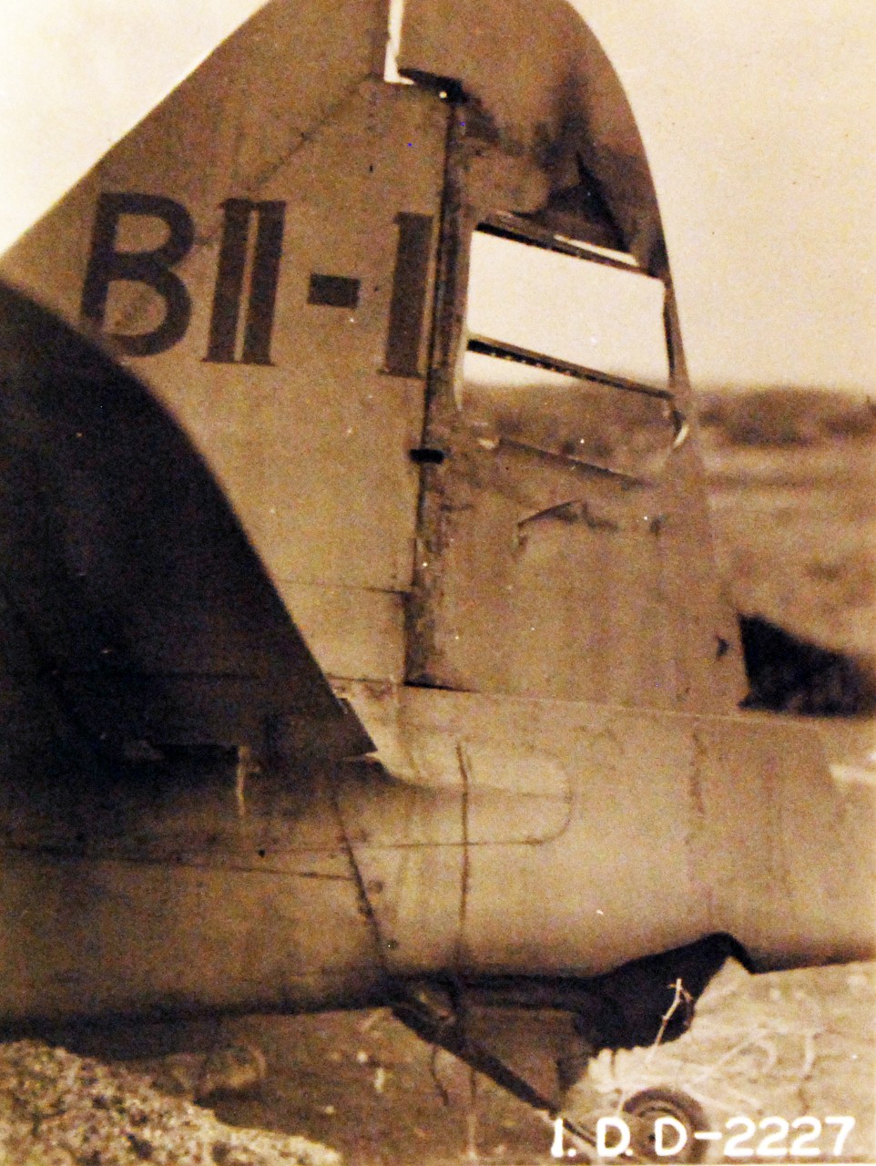 80-G-22160:   Japanese Attack on Pearl Harbor, December 7, 1941.   Crash of Japanese A6M2, B11-120, from Japanese carrier, Hiryu,at Niihau Island site.  Note tail section from the wrecked Zero.  Photograph released probably 1942.  Official U.S. Navy photograph, now in the collections of the National Archives.  (2016/09/20).