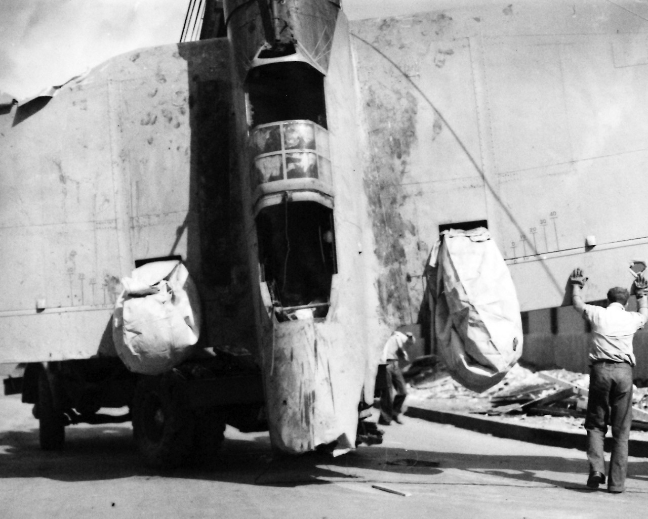 80-G-33014:   Japanese Attack on Pearl Harbor Attack, 7 December 1941.    Japanese Navy Type 99 Carrier Bomber, an Aichi D3A “VAL”,  shot down during the attack.   U.S. Navy photograph, now in the collections of the National Archives.  (9/13/2013).