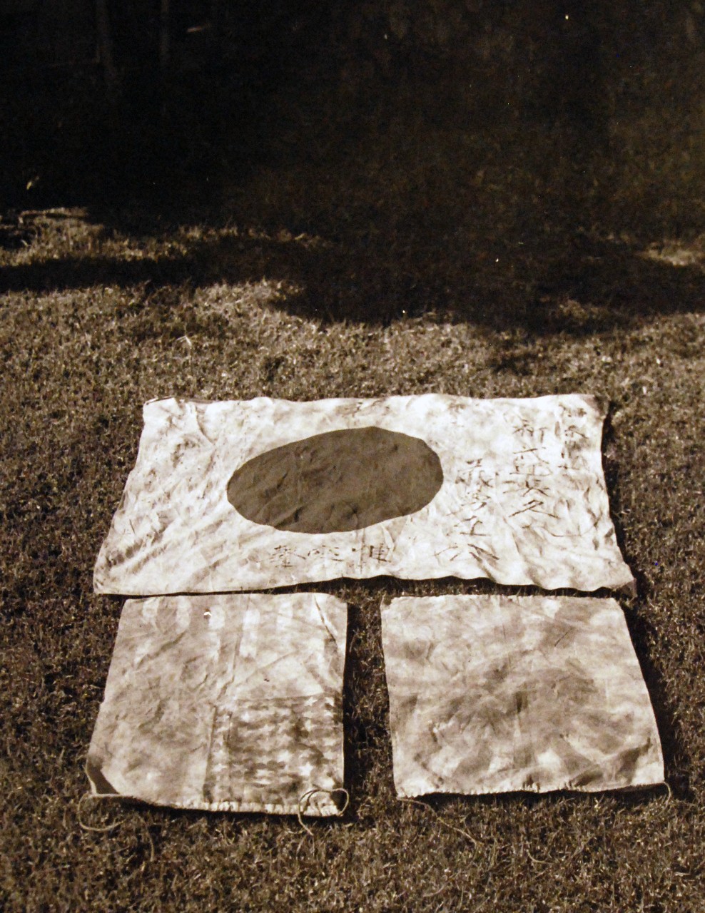 80-CF-1063-5:   Captured flags from Japanese submarine in the Hawaiian raid.  These were taken to Naval Air Station, San Diego, California, where they were photographed on 13 December 1941.  Official U.S. Navy Photograph, now in the collections of the National Archives.    Official U.S. Navy Photograph, now in the collections of the National Archives.           (9/16/2014).