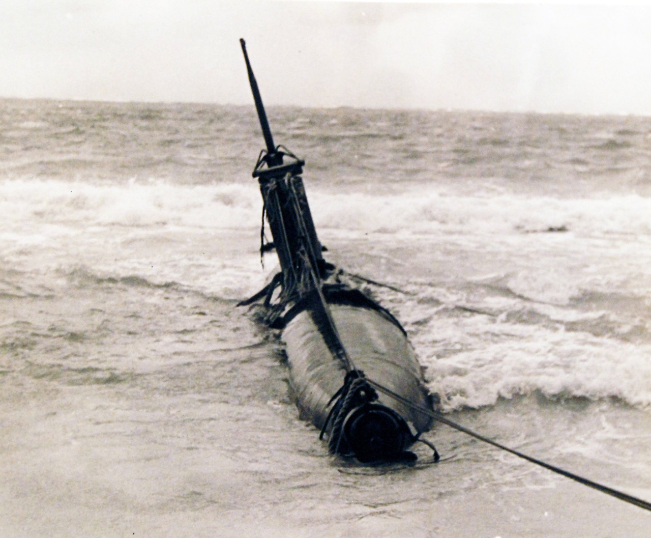 80-G-32683:   Pearl Harbor Attack, December 7, 1941.    HA-19.  (Japanese "Type A" midget submarine).  Beached in eastern Oahu, after it unsuccessfully attempted to enter Pearl Harbor during the attack.  The photograph was taken on or shortly after 8 December 1941.   Official U.S. Navy photograph, now in the collections of the National Archives. (7/2/2014).