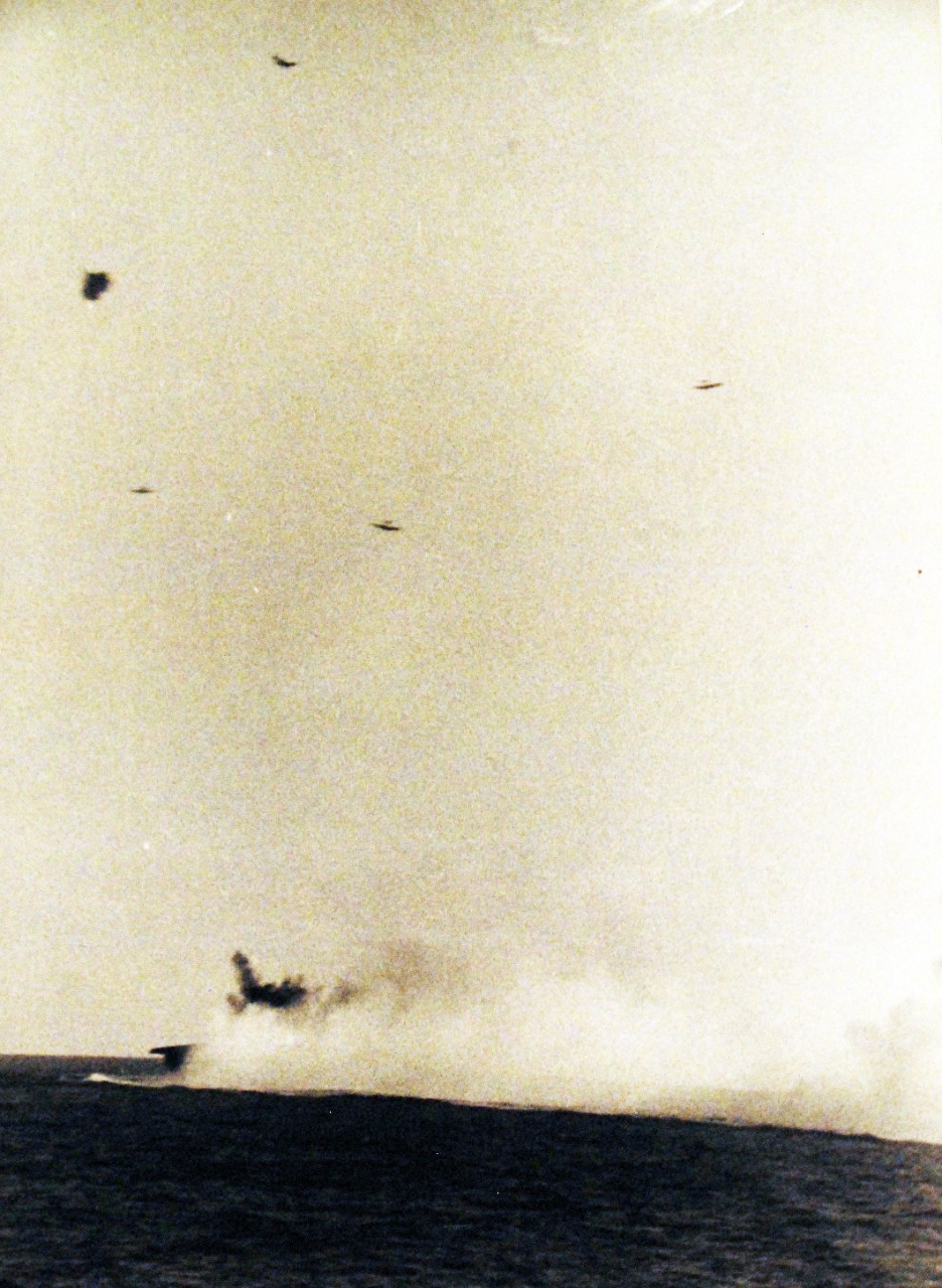80-G-299807:  Battle of the Eastern Solomons,  24 August 1942.   Japanese dive bombers that attacked USS Enterprise (CV 6) during a period of 4 minutes somewhere in the South Pacific.  As seen from USS Portland (CA 33).     Official U.S. Navy Photograph, now in the collections of the National Archives.  (2016/07/05).