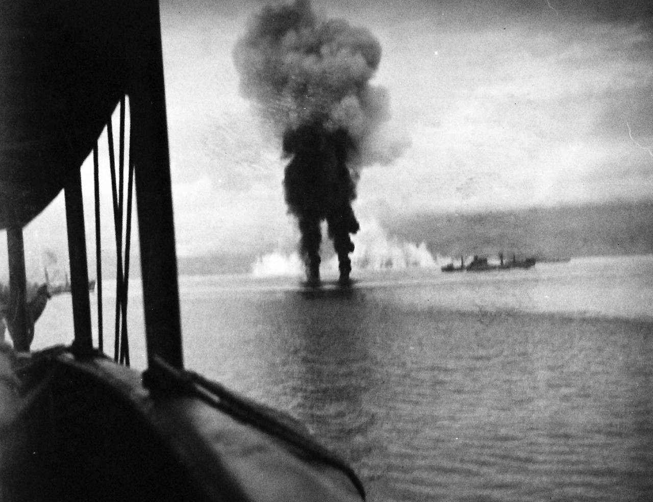 80-G-32367:  Naval Battle of Guadalcanal, 12-15 November 1942.  Smoke rises from two enemy planes shot down during a Japanese air attack on U.S. ships off Guadalcanal, 12 November 1942. Photographed from USS President Adams (AP-38).  Ship at right is USS Betelgeuse (AK-28). That at left, barely visible beyond President Adams' structure, is USS Libra (AK-53). Smoke in the center distance appears to be a smoke screen. Official U.S. Navy Photograph, now in the collections of the National Archives.. (2016/05/17).