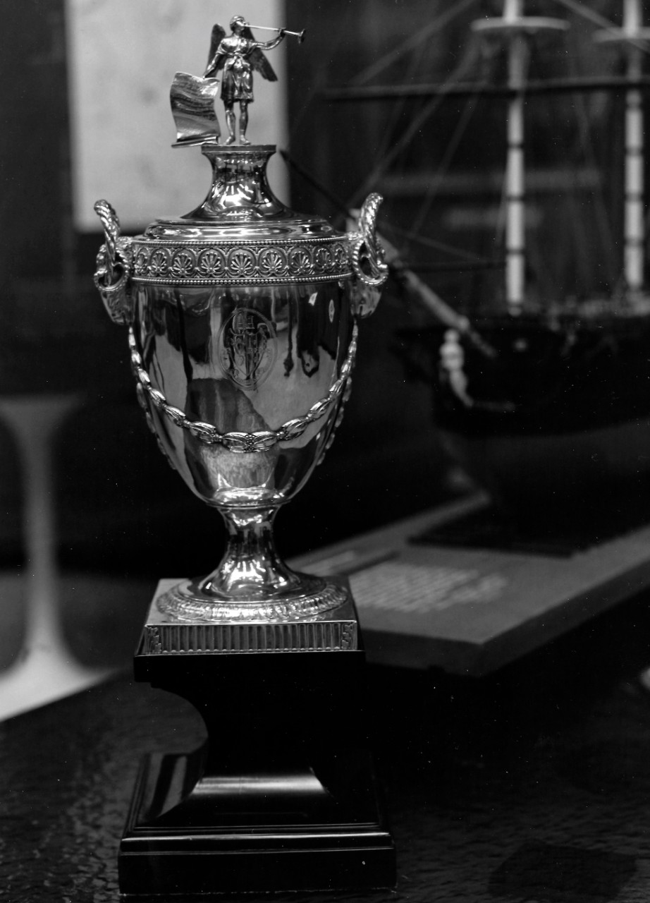 NMUSN-Photo-7:   Pearson’s Cup.  The Russia Company presented the cup to Captain Sir Richard Pearson in 1780 for his gallant efforts to save 41 ships carrying naval supplies.   The cup is inscribed: “To Captain Pearson Knt.  Who on the 23 of Sept. 1779 in his Majesty’s ship Serapis, protected a numerous & attack of a Superior force.  The Russia Company, presents this vase, as a testimony of their Sense of Bravery & Conduct, on that occasion.”   Courtesy of Captain and Mrs. Paul Hammond.  .” National Museum of the U.S. Navy Photograph Collection.  