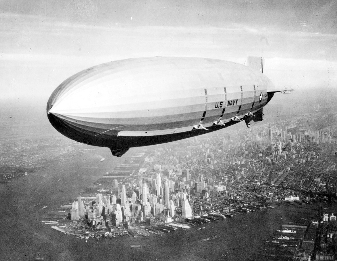 USS Macon (ZRS-5), flying over New York Harbor, summer 1933.   Naval History and Heritage Command Photograph, NH 43901.