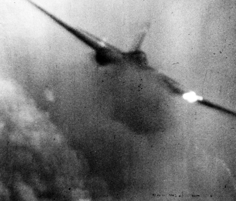 Japanese Kamikaze Attack, June 1945.   Flames stream out from a Japanese Kamikaze as it is hit by anti-aircraft fire, June 28, 1945.  Official U.S. Navy Photograph, now in the collections of the National Archives, 80-G-49708. 