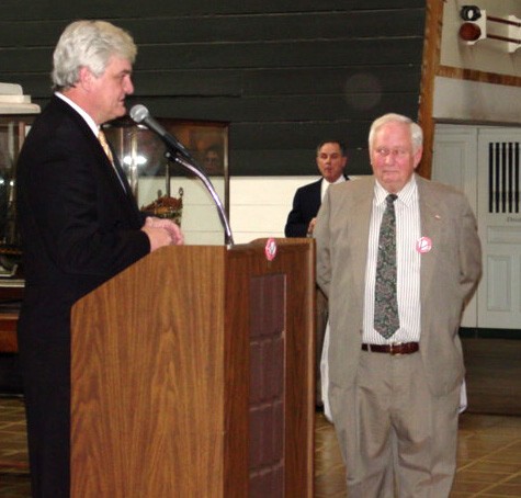 NMUSN-5174: Visions of Infamy Exhibit, December 2001. Artist Tom Freeman gives remarks during the opening of the exhibit. To his right is Mr. Bryant Costellow, a subject of one of his paintings at the Navy Museum (now National Museum of the U.S. ...