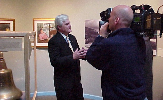 NMUSN-5177: Visions of Infamy Exhibit, December 2001. Artist Tom Freeman talks to Fox DC 5 about his new exhibit at the Navy Museum (now National Museum of the U.S. Navy), Washington Navy Yard, Washington, D.C. National Museum of the U.S. Navy Ph...