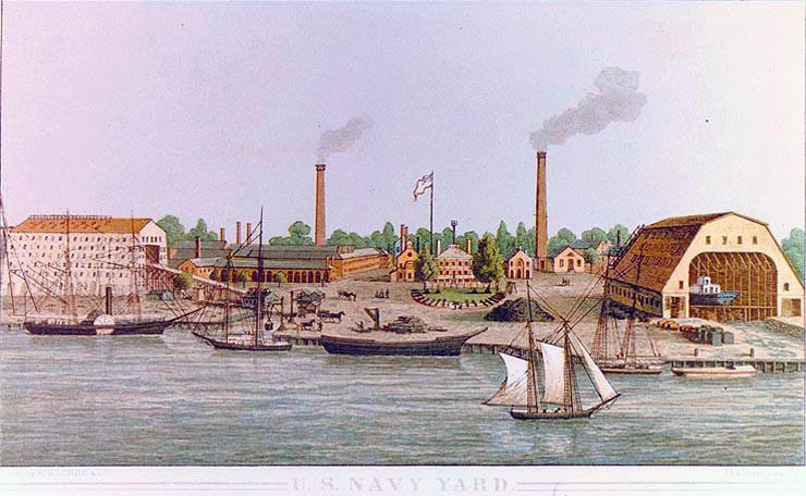 Washington Navy Yard,  Lithograph published by E. Sachse & Company, Baltimore, Maryland, circa 1862. It depicts the Navy Yard as seen from above the Anacostia River, looking north, with Building # 1 and the trophy gun park in the center. Courtesy of Mrs. Worth Sprunt, 1974. U.S. Naval History and Heritage Command Photograph.  NH 79896-KN.  