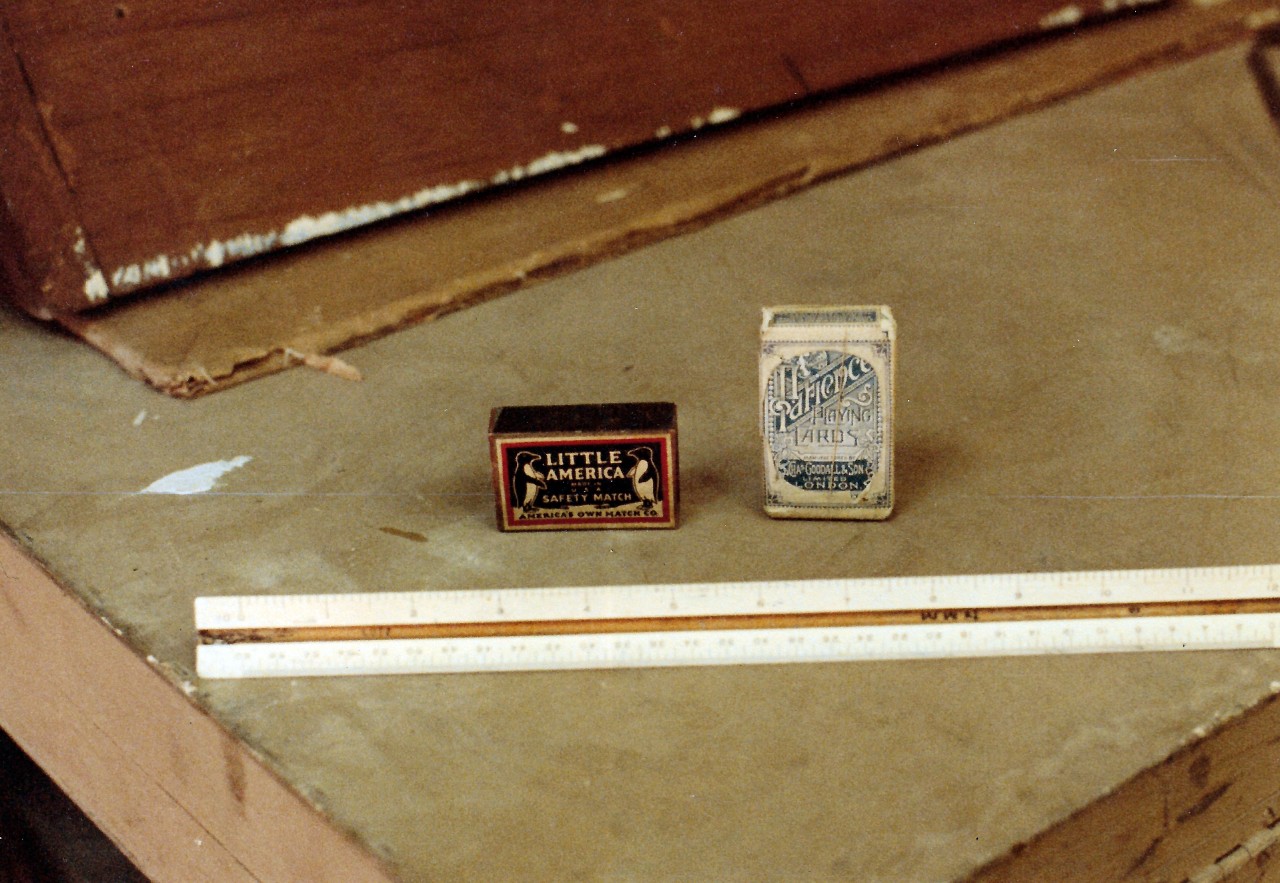 NMUSN-2162 (Color):   Polar Exhibit, 1984.    Playing cards and matches used by Finn Ronne of the team of Rear Admiral Richard E. Byrd during his missions to the continent.   This artifact was on display when the exhibit was a permanent exhibit at the National Museum of the U.S. Navy.    National Museum of the U.S. Navy Photograph Collection.  