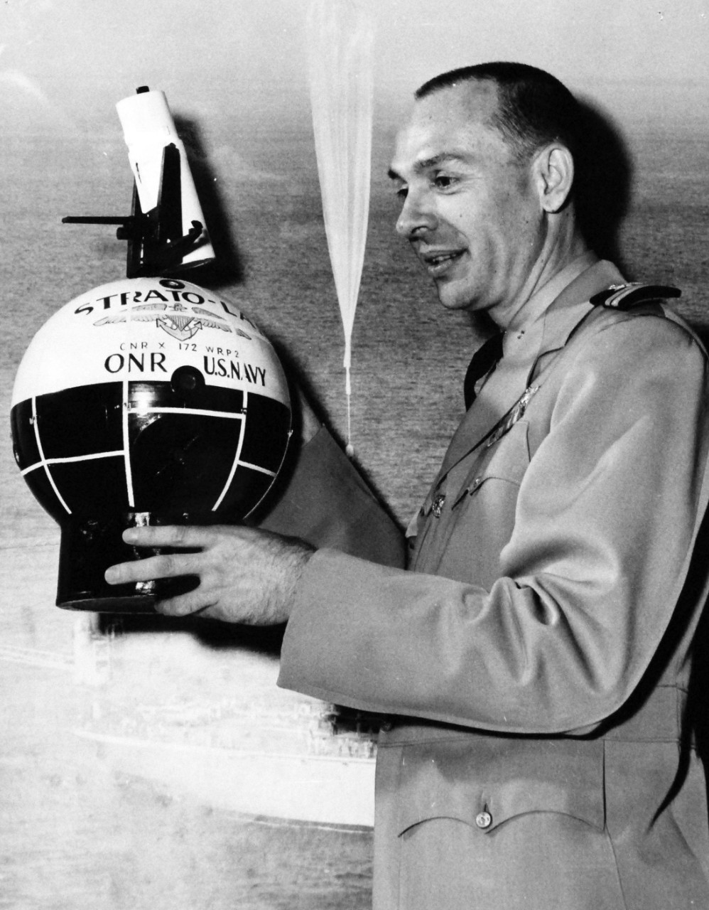 USN 1036187:    Model of Strato-Lab  Gondola.  Commander Malcolm D. Ross, USNR, holds a model of the Strato-Lab Gondola with 16-inch telescope on top, circa 1961.  Official U.S. Navy photograph, now in the collections of the National Archives.     