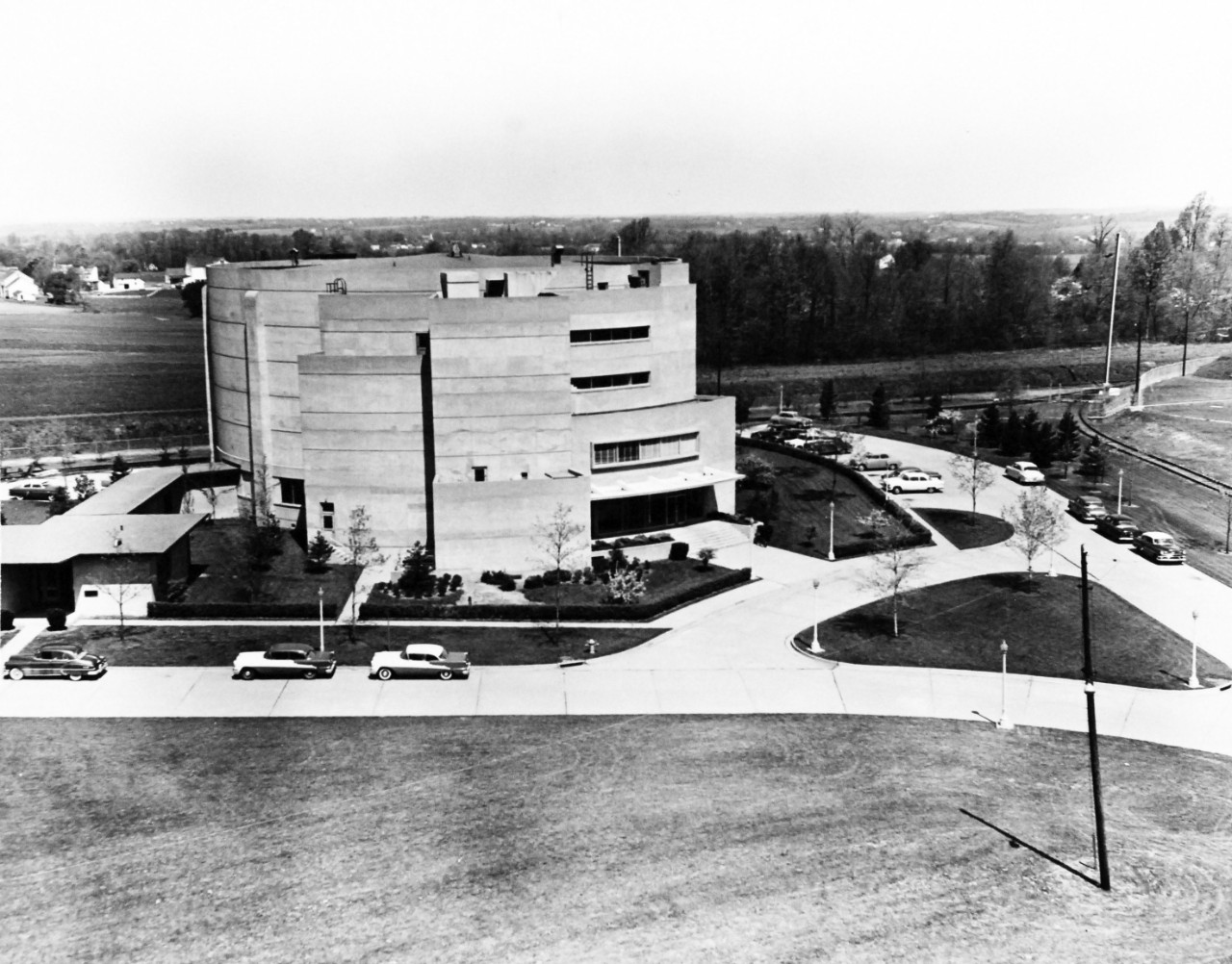 USN 1036458:  Aviation Medical Accelerator Laboratory (AMAL), late 1950s.   As a vital part of the Naval Air Development Center at Johnsville, Pennsylvania, the AMAL houses the world’s largest human centrifuge in the center of the of the 110-foot floor is a 180-tone, 4,000 horsepower vertically mounted D-C motor.  Used in researching simulated space flights, the motor has an instantaneous rating of 16,000hp, late 1950s.   AMAL is noted for being used for flight simulation training for the Project Mercury astronauts.   Official U.S. Navy Photograph, now in the collections of the National Archives.  