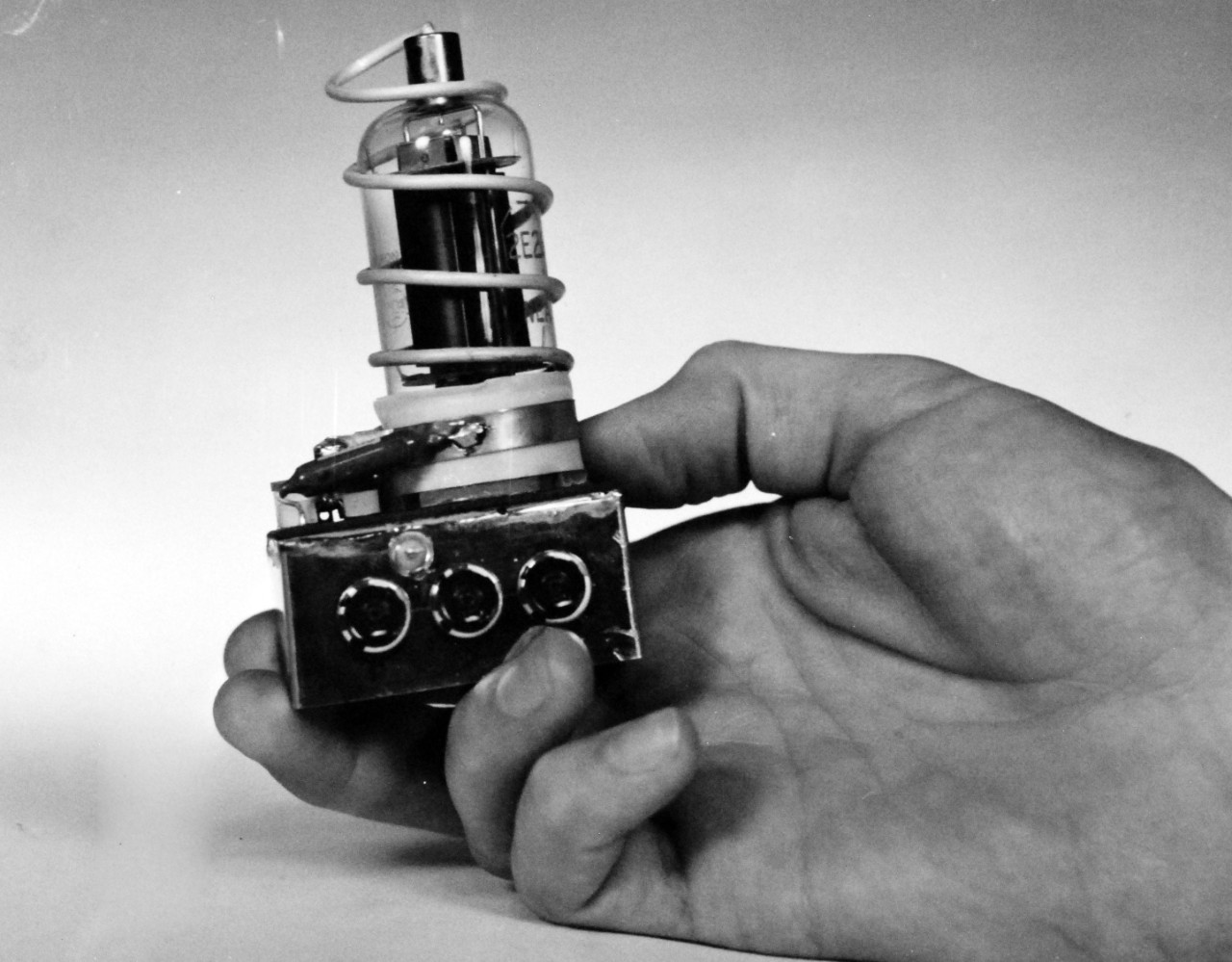 USN 710310:    TV-Type Camera for Lunar Probes.  Navy Builds TV-Type Camera to Photograph from Lunar Probes.  Navy scientists have designed and built a TV scanner system to picture the moon.  The unit was carried in the Air Force Lunar Probe Fighter Rocket launched on October 11, 1958, in an attempt to orbit the moon.  Constructed at the Naval Ordnance Test Station, China Lake, California, the unit was designed to scan the surface of the moon from horizon to horizon, gradually covering the whole moon’s surface as the satellite advanced around the moon.   Official U.S. Navy photograph, now in the collections of the National Archives.     