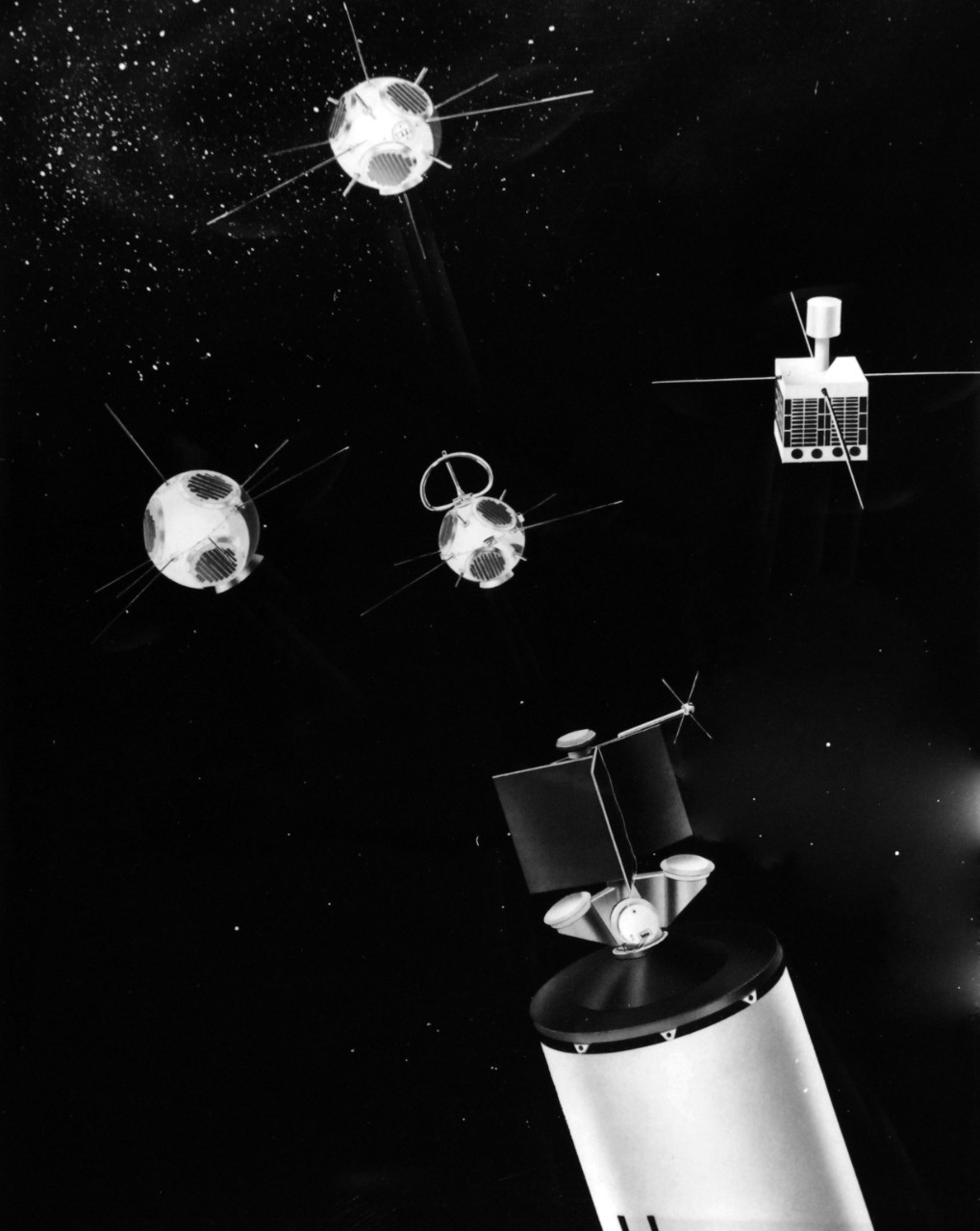 USN 711006:  Artist’s Conception of Composite I Payload Separation Sequence showing Solar Radiation IV to the right, and top to bottom center, Army Corps of Engineers Ranging and Calibration Satellite, Lofti II and Injun II.  Surcal I is the drum like attachment at the base of the payload support structure.  The antenna protruding downward from the end of the rack is part of the Surcal instrumentation.  Photograph released January 24, 1962.  Official U.S. Navy Photograph, now in the collections of the National Archives.  