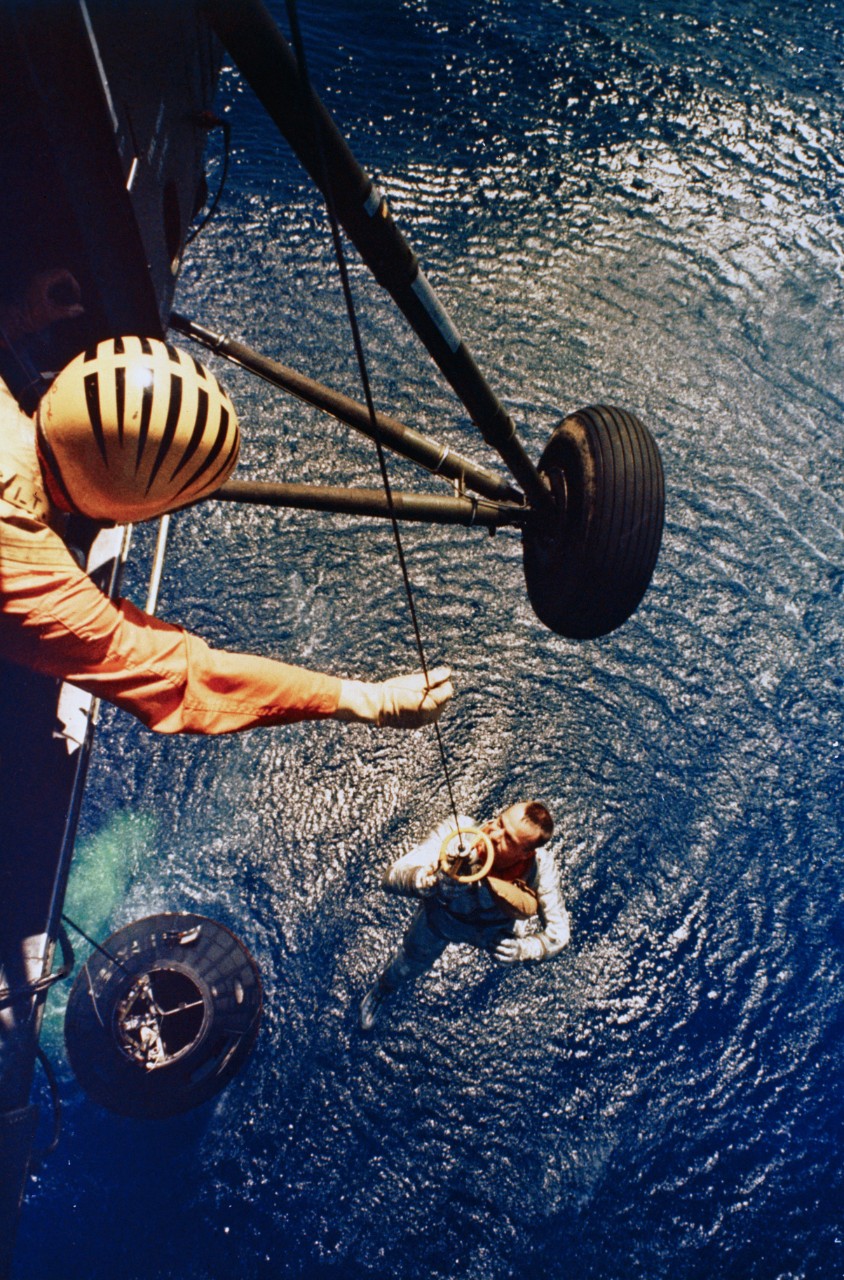 1961 - Picking Up Alan Shepard A Marine helicopter lineman assists Mercury 3 Astronaut Alan Shepard from the waters of the Atlantic Ocean. Shepard conducted a fifteen minute sub-orbital flight in Freedom 7 and became America’s first man in outer space. (Photo courtesy of NASA)