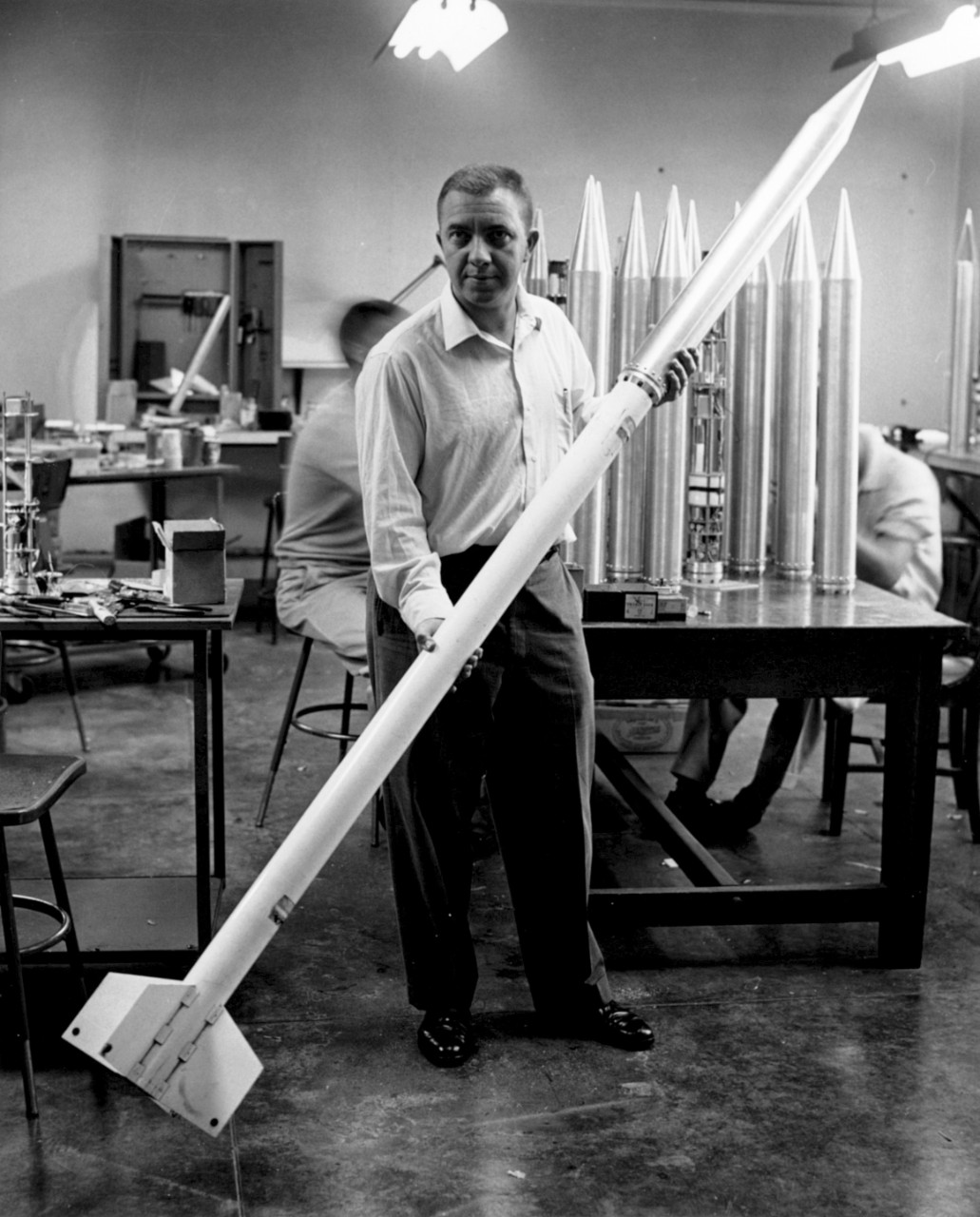 1954 - Naval Officer and Rocket Scientist Astrophysicist and U.S. Naval officer James Van Allen is shown here holding a sounding rocket. After serving as an ordnance officer in World War II, Van Allen’s goundbreaking research work into rockets and radiation belts were vital to getting humans safely into outer space. Among the many honors he received, Time magazine awarded him their “Man of the Year” prize in 1960. (Photo courtesy of NASA/JPL)
