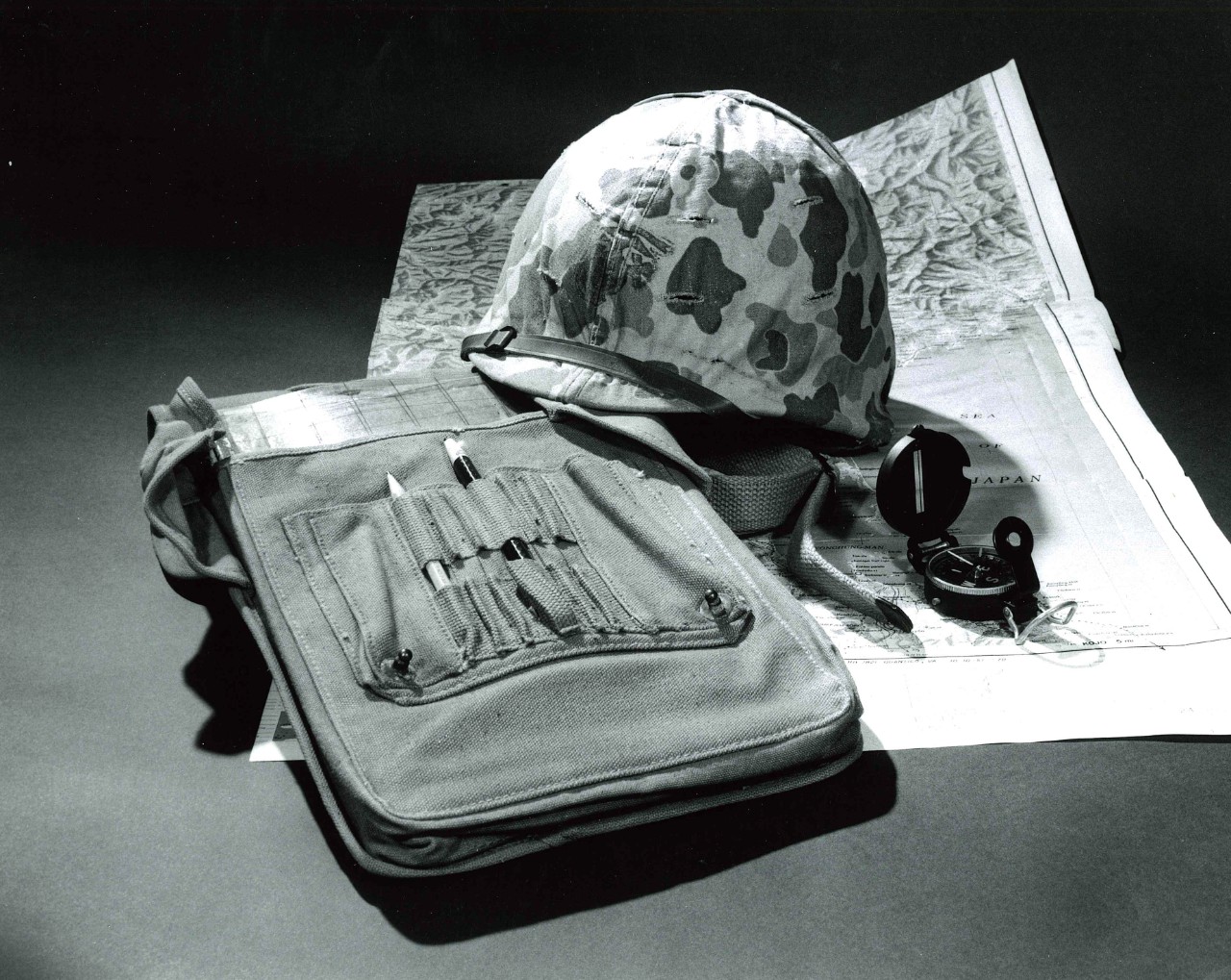 NMUSN-2849: Helmet, bag, and map of Japan, 1970s. Artifacts were in the Navigation Exhibit area. National Museum of the U.S. Navy Photograph Collection.