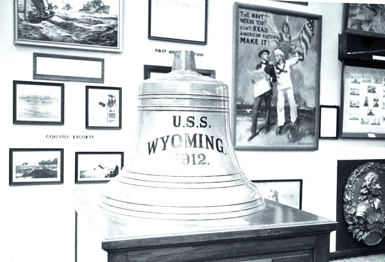 NMUSN-4773: World War I, 1970s. USS Wyoming (BB-32) bell, obverse side This photograph shows the World War I exhibit area before it was remodeled to the last configuration before the exhibit was removed in 2022. National Museum of the U.S. Navy P...