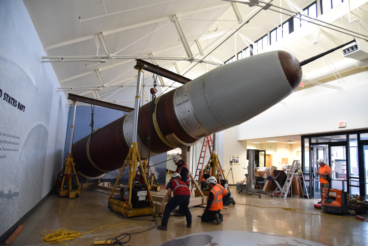 NMUSN-5326: Trident I (C-4), October 2023. Trident is being removed from the Cold War Gallery, Washington Navy Yard, Washington, D.C. The fleet ballistic missile is being lowered. National Museum of the U.S. Navy Photograph Collection.