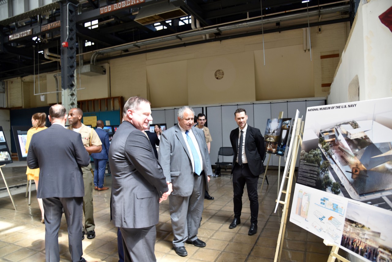 Secretary of the Navy Carlos Del Toro views conceptual renderings from one of the five architecture firms at the National Museum of the Navy, Washington Navy Yard, Washington, D.C., on April 13, 2023. Director of the Naval Museum Division, Dr. Ch...