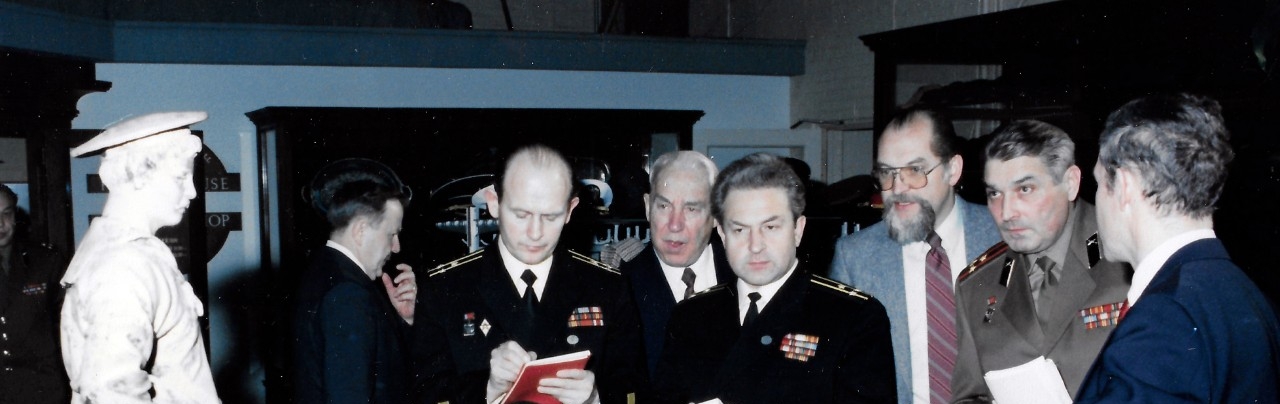<p class="MsoNormal">NMUSN-109:&nbsp;&nbsp; Soviet
Military Museum Delegation, December 1988.&nbsp;&nbsp;&nbsp;
On December 16, 1988, a delegation of Soviet military museums visited
the Navy Museum (now National Museum of the U.S. Navy) under an exchange which
promoted an understanding of the two countries’ military museums.&nbsp;&nbsp; Shown:&nbsp;
Director of the Navy Museum, Oscar P. Fitzgerald, Ph.D., tells about the
Boatswain’s Mate Charles W. Riggins sculpture to the Soviet delegates during
the visit to the Navy Museum.&nbsp;&nbsp;&nbsp; National
Museum of the U.S. Navy Photograph Collection.&nbsp;&nbsp;</p>
