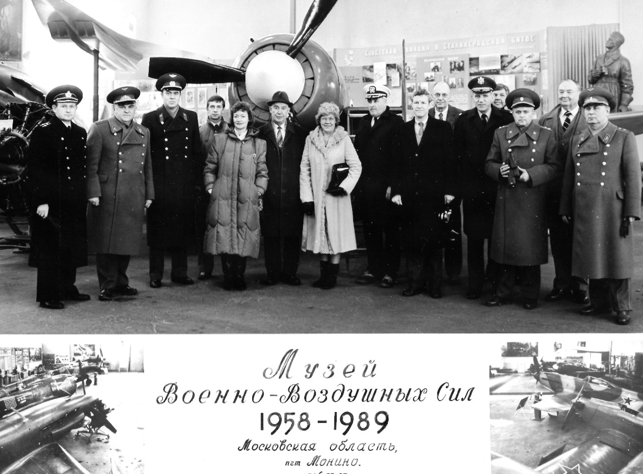 NMUSN-131:   Central Air Force Museum, Moscow, Russia, February-March 1989.   The Navy Museum’s Director, Oscar P. Fitzgerald, Ph.D., is the third from left, front row.   The Deputy Director, Ms. Claudia Pennington, is the fourth from right.   Naval Aviation Museum’s Director Robert L. Rasmussen is the second from left, last row.  This photograph was taken following the Soviet Military Museum contingent which visited the United States in December 1988.   The Chairman of the U.S. Joint Chiefs of Staff and his Soviet counterpart, Marshal of the USSR, Sergei F. Akrohomeyev, approved an exchange of military museum directors in 1987.  This exchange promoted better understanding between the two countries.    National Museum of the U.S. Navy Photograph Collection.  
