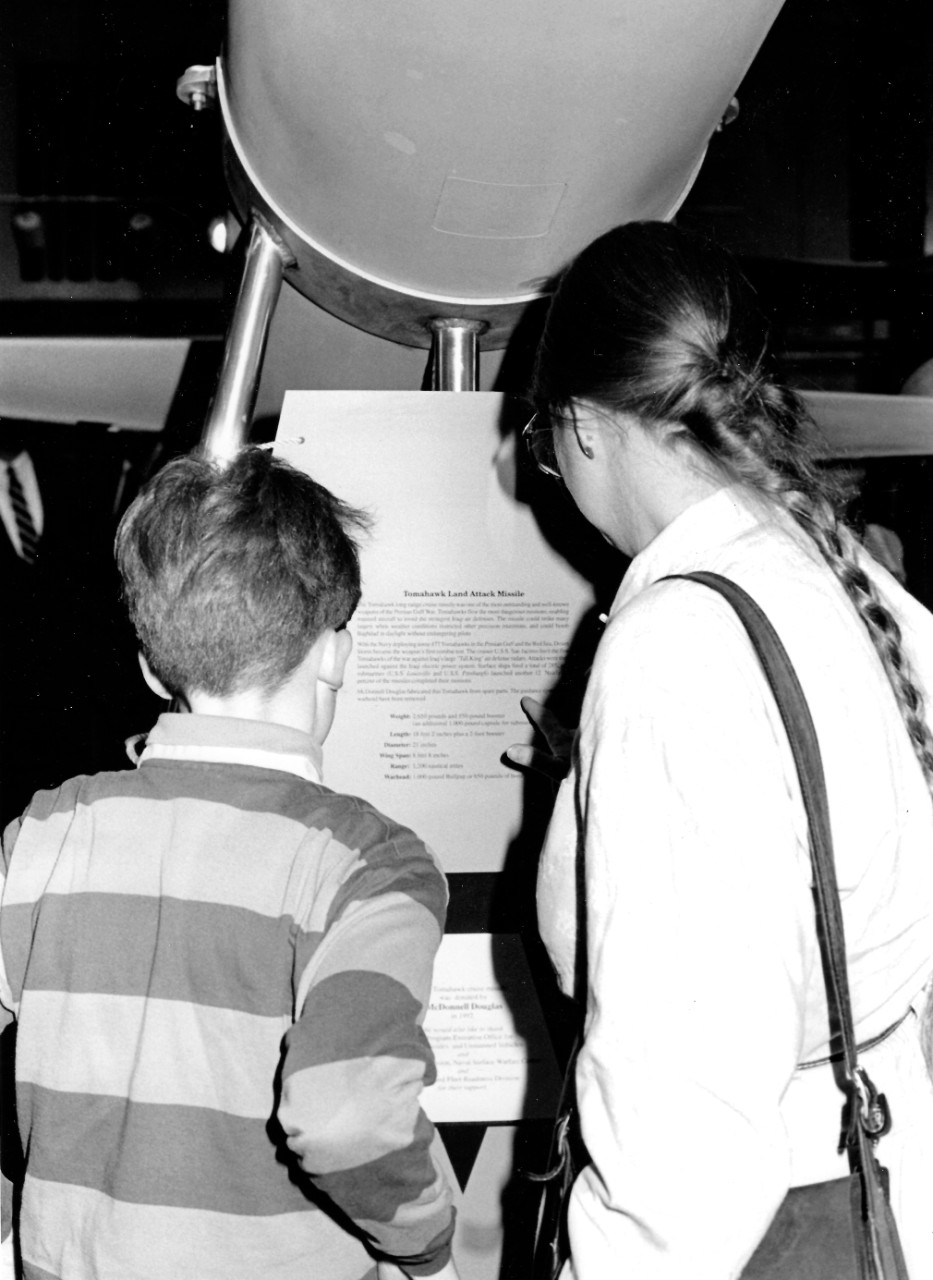 NMUSN-70:  Visitors view the Tomahawk Land Attack Missile, January 26, 1993.   Presentation was held at the Navy Museum (now National Museum of the U.S. Navy) on the acceptance for display purposes.   National Museum of the U.S. Navy Photograph Collection. 