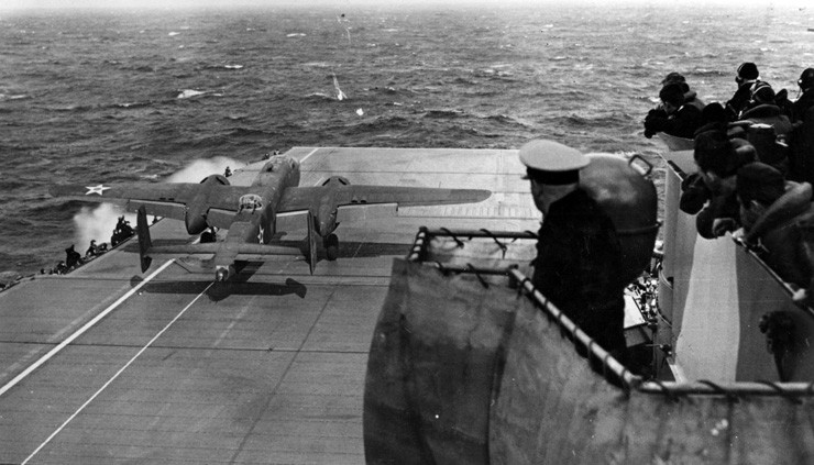 Photo of a B-25B Mitchell bomber launching on the Doolittle Raid from the deck of the carrier Hornet.