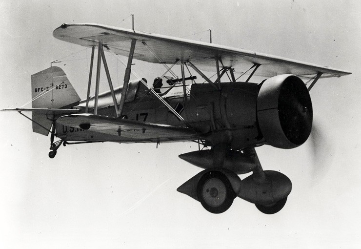 Photo of a BFC-2 Goshawk carrying an external fuel tank in flight.