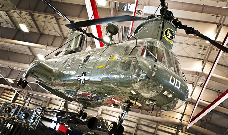 Photo of the Museum's CH-46D Sea Knight suspended on display in the Hangar Bay One building.