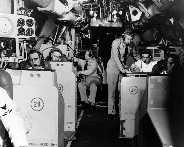 Photograph showing radar stations in interior of fuselage of WV/EC-121 Warning Star aircraft.