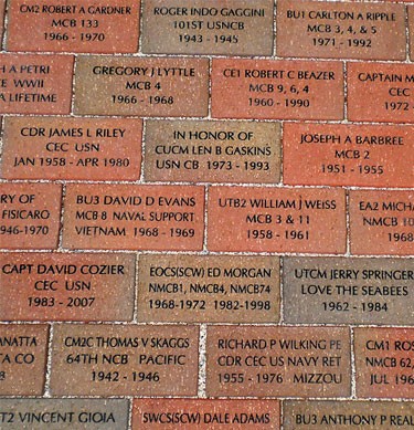 A walkway paved with commemorative bricks. Each brick has information honoring a loved one