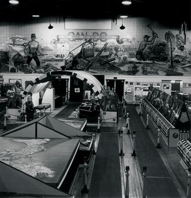 An elevated view of the original Seabee Museum interrior, showing some aisles and exhibits