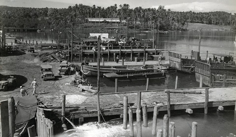 Finger piers (18’ by 96’) at Navy Base 3070, Zamboanga, Philippines, used expedite engine overhaul and torpedo servicing at MPT base, 25 June 1945.