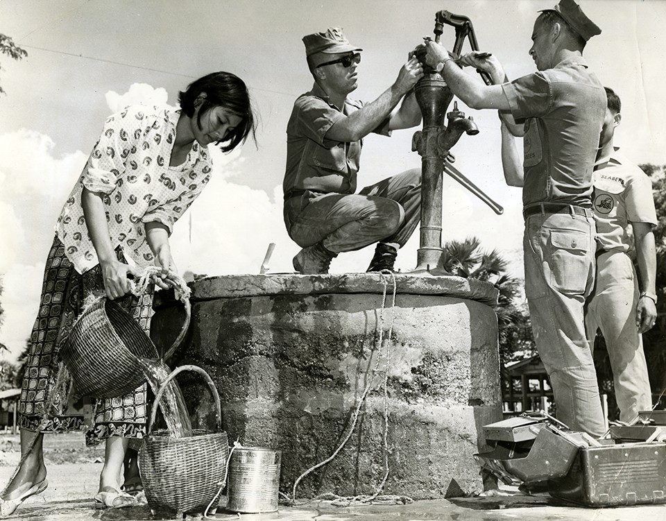 Seabees with Seabee Team 0306 install a water pump for the village of Phon Thong in Thailand.