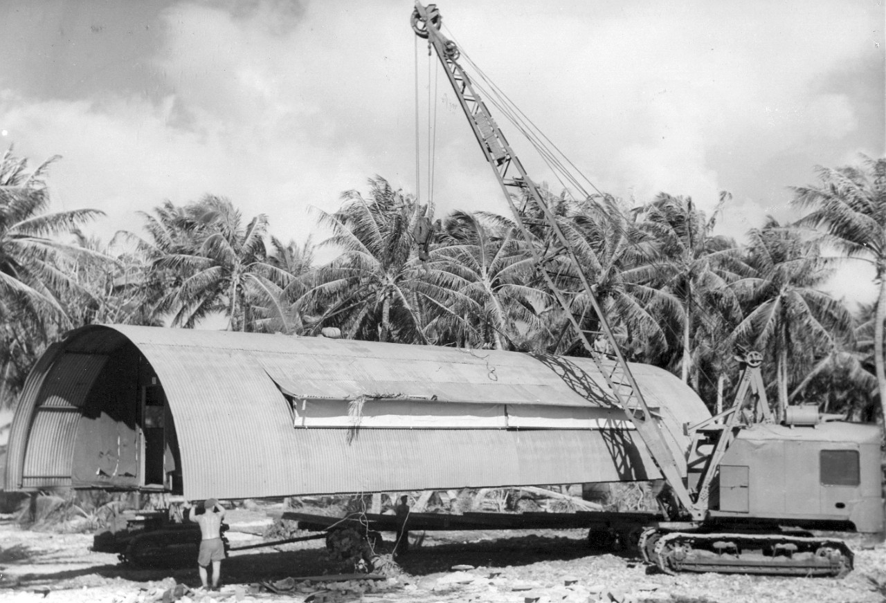 Placing the Quonset hut on a trailer bed, Majuro Atoll.
