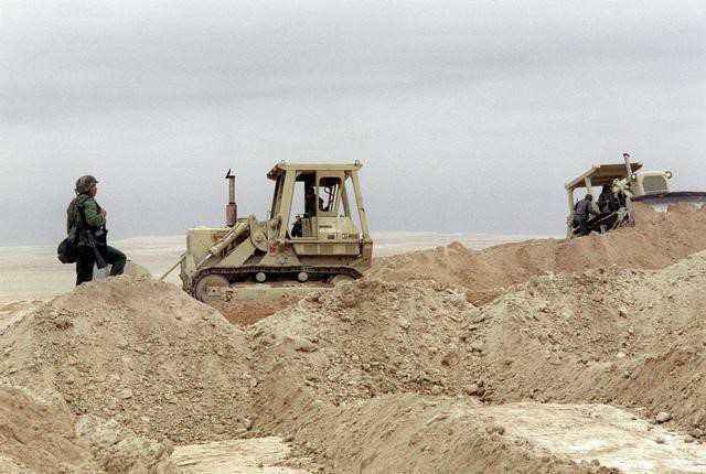 <p>Equipment Operators at Work in the Desert, exact location unknown, 1990.</p>
