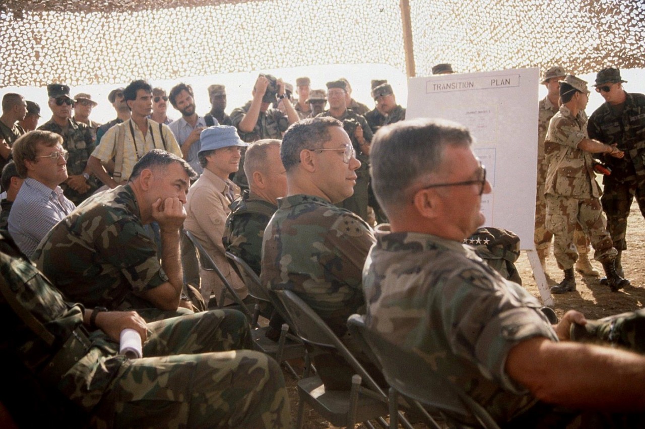 General Shalikashvili and General Colin Powell listening to CM2 Lanning recite his poem “The Kurdish Catastrophe” during Operation Provide Comfort, Kurdistan, 1991. 