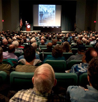 a meeting for Military Outreach showing the crowd facing the front of the room