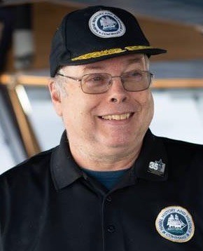 NHHC Director Sam Cox aboard Petrel