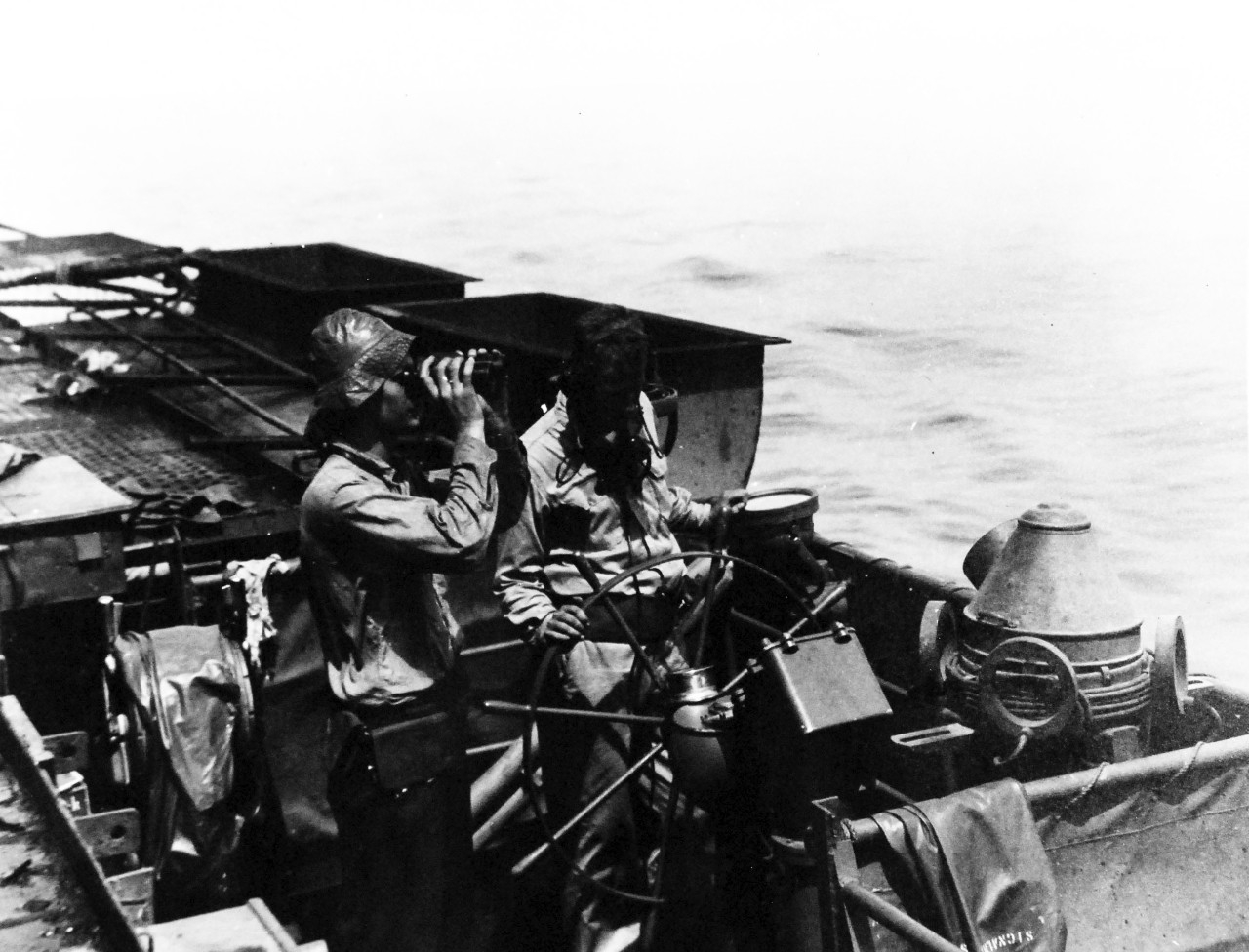 80-G-270674:   Battle off Samar, Japanese Kamikaze, October 25, 1944.    An emergency bridge manned on after flight deck of USS Suwannee (CVL-27) was attacked by Japanese kamikaze plane off Leyte Gulf, Philippines.    Official U.S. Navy Photograph, now in the collections of the National Archives.   (2014/4/24). 