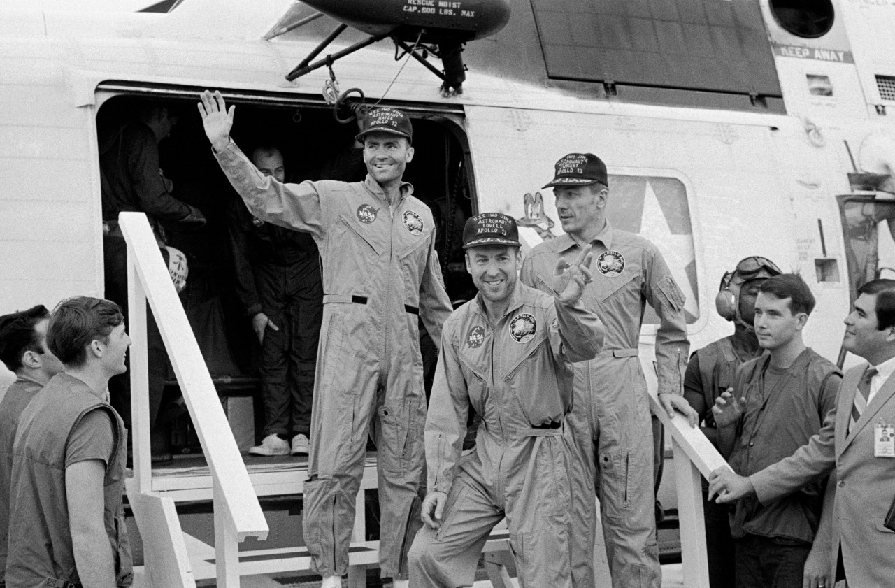 <p>the Apollo 13 crew step aboard the USS <i>Iwo Jima</i></p>
