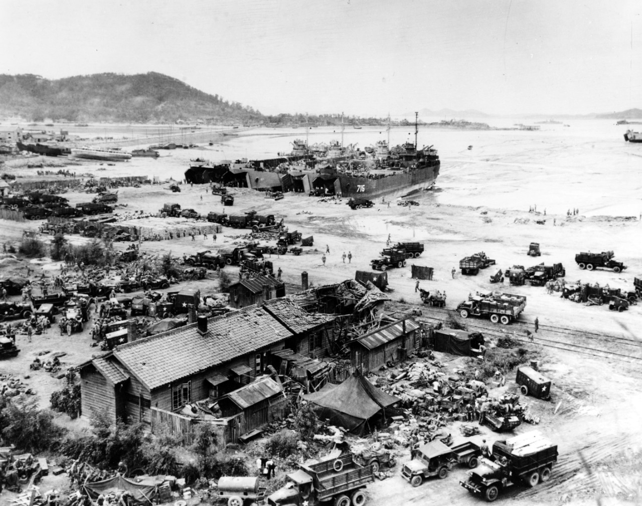 Four LSTs unload men and equipment while high and dry at low tide on Inchon's Red Beach, 16 September 1950, the day after the initial landings there.