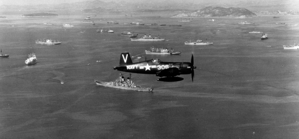 Vought F4U-4B Corsair, of Fighter Squadron 113 (VF-113) from USS Philippine Sea (CV-47), flys combat air patrol over U.S. warships and U.N. shipping in Inchon anchorage, South Korea, 2 October 1950.